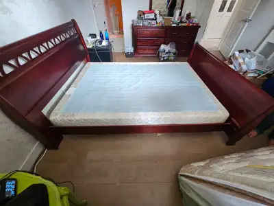 Wood bed frame with head board and foot board for sale. Includes full/double size box spring mattres...
