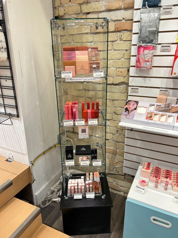 Open Face Glass Shelving/Display Unit with Black Stand at Bottom