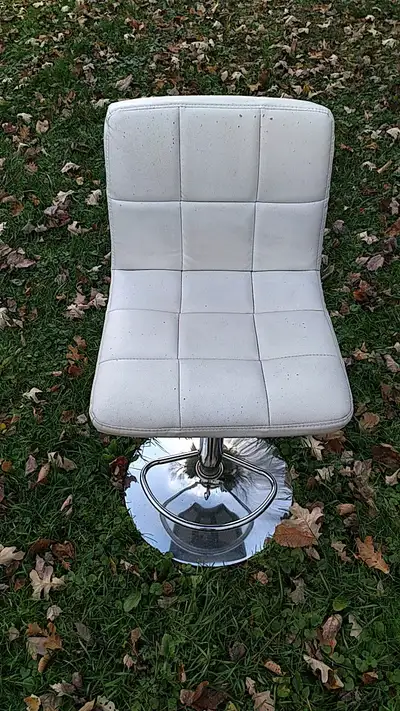 Adjustable height bar height chair, steel base, cushioned seat with vinyl covering, overall in good...
