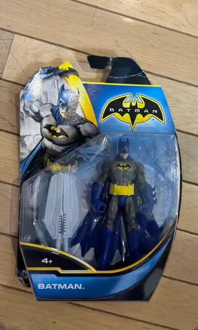 I am selling a brand new, still in package DC Comics Batman action figure. The figure features a cla...