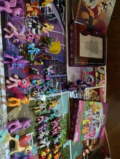 My Little Pony play set which includes 42 figures, 8 themed play mats(2), and 2 books. This set is p...