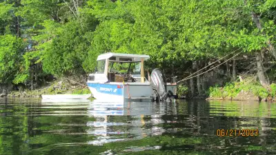 Brand new Evinrude G2 150 Hp Outboard (6 hours). I bought this boat and converted it to an outboard....