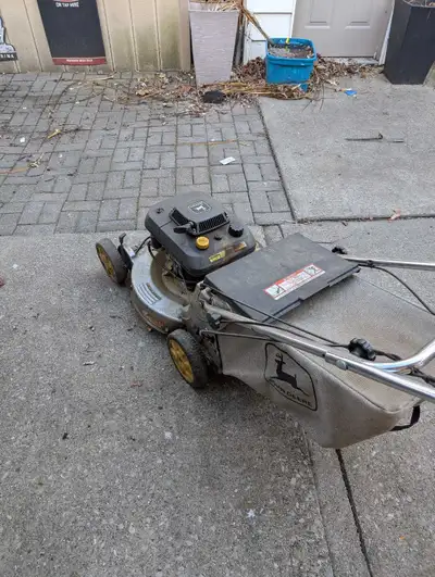 John Deere 14SB Lawn Mower Self propelled with Kawasaki engine, aluminum deck and bag. Needs a blade...