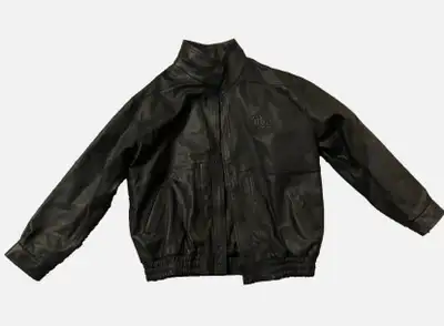 This is a handsome, gently worn genuine leather bomber jacket in men's XLT. It's a Trican Oilfield s...