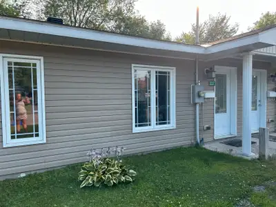 Stunning Newer Slab on Grade ICF home with infloor radiant heat and backyard. Comes with all applian...