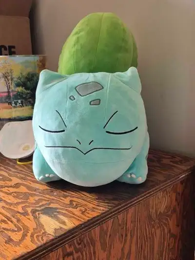 This pre-loved Pokémon Bulbasaur plush is ready for a new home, offering the perfect soft companion...
