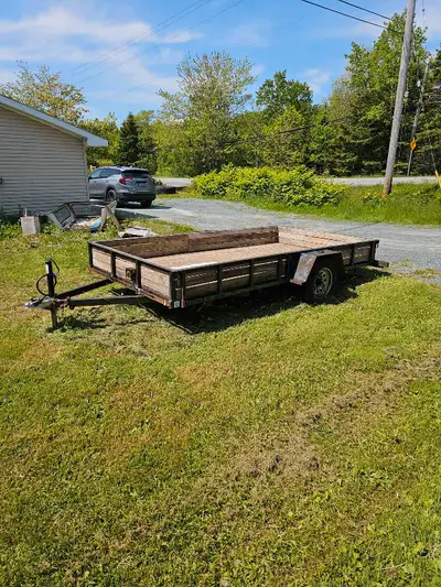 Utility trailer 6ft 5 wide by 12ft 2 long inside has 5000 lbs torsion axle with electric brakes all...
