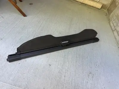 This used cargo cover is designed to fit perfectly in your vehicle, providing an extra layer of secu...