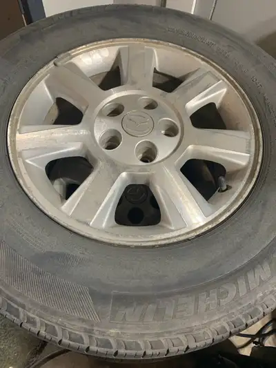 Five wheels and tires to fit Mazda. Fifth black rim and tire. All five for $160. Call 780-937-2468....