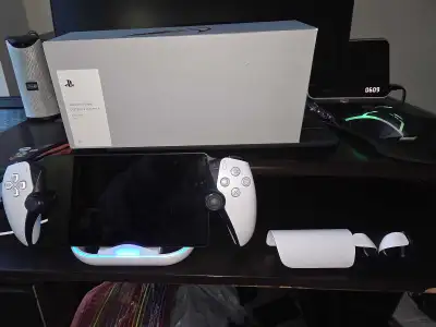 This Sony PlayStation Portal Remote Player paired with the Pulse Explore Wireless Earbuds and LED ch...