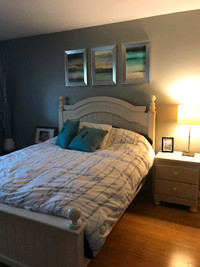 double bed frame, dresser with mirror, bookshelf, side table
