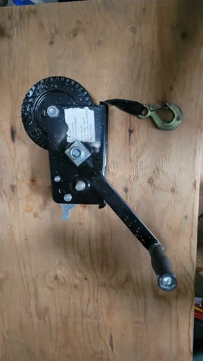2000lb hand winch. Strap style. Like new
