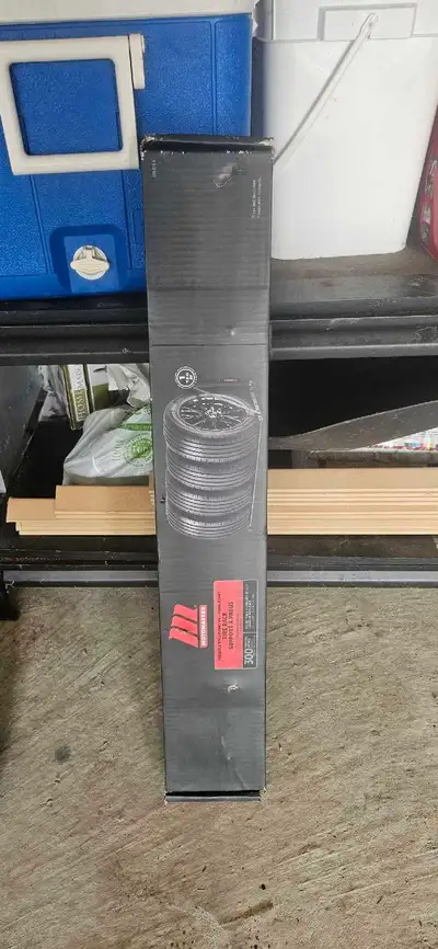 I'm selling a brand new, Motomaster foldable wall-mounting tire rack, capable of holding up to 300 p...