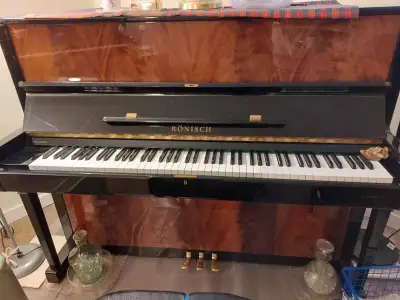 Ronisch (German) Upright piano in two-tone polished brown., View more