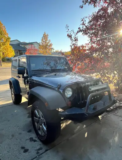 2011 Jeep Wrangler Sport. 2 Door. Air Tilt, Cruise. Excellent condition inside and out. Extra set of...