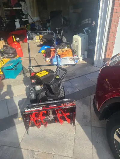 This pre-owned Yard Machines snow blower features a powerful 5.5HP engine and a 22-inch clearing wid...