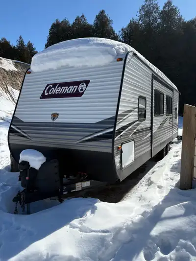 Trailer has a queen bed at one end and a set of double bunks at the back. Stove and oven have never...