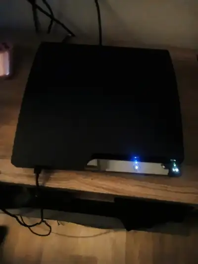 Sony PlayStation 3 Console with Two Controllers, View more
