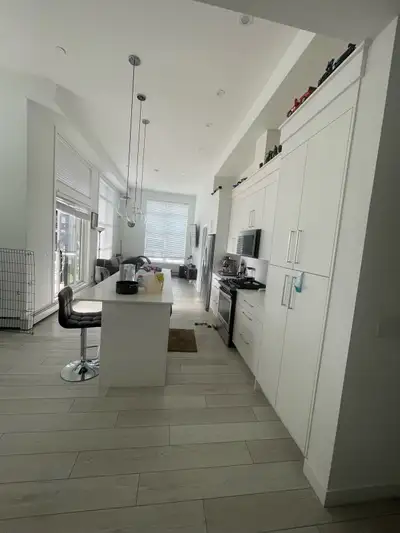 Room for Rent in West Springs, SW Calgary ️ A bedroom with a bed and desk in a modern 2-bedroom apar...