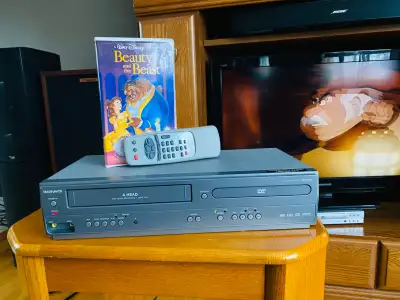 The Magnavox CMWD2206 is a versatile entertainment device that combines the convenience of a DVD pla...