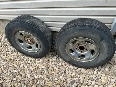 2 x LT235/85R16 Bridgestone Blizzak W965 tires on Dodge rims. The rims are off a 2nd Gen Dodge Ram 1...