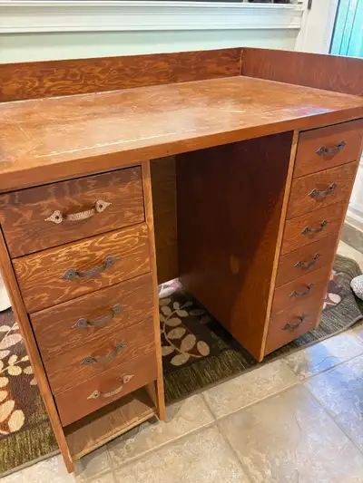Solid wood desk, not press board, on wheels. One drawer is missing. 40” wide x 24” deep x 36.5” high...