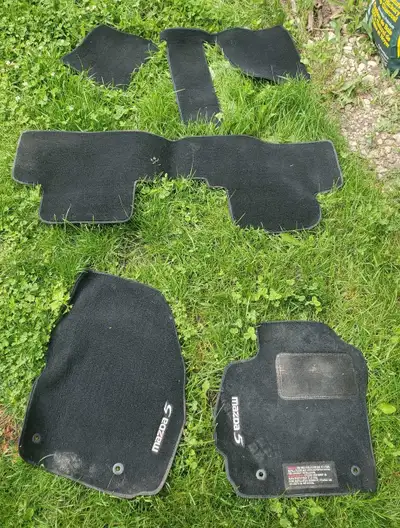 These are the genuine Mazda 5 floor mats, designed to perfectly fit your vehicle and protect its int...