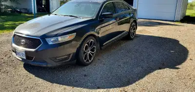 2014 Ford Taurus Sho. Runs greats, transmission shifts smooth, will need rocker panels, windshield,...