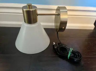 White and brass plug in wall sconce (IKEA FLUGBO), View more