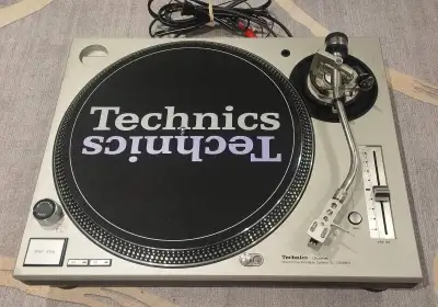 Technics SL-1200MK5 silver direct drive turntable. Includes a brand new technics slip mat put on and...