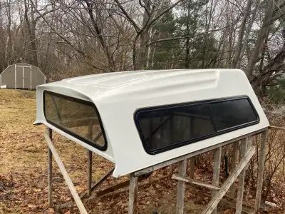 This is an 8-foot truck cap, previously installed on a Ford F-150. Good condition. It features slidi...