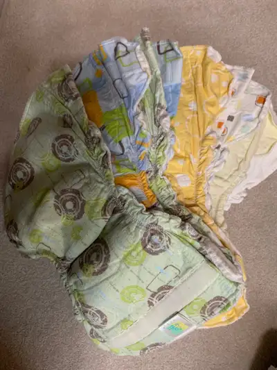 Large collection of assorted diapers. Great way to try a variety of different styles including prefo...