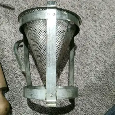 Vintage metal strainer., View more