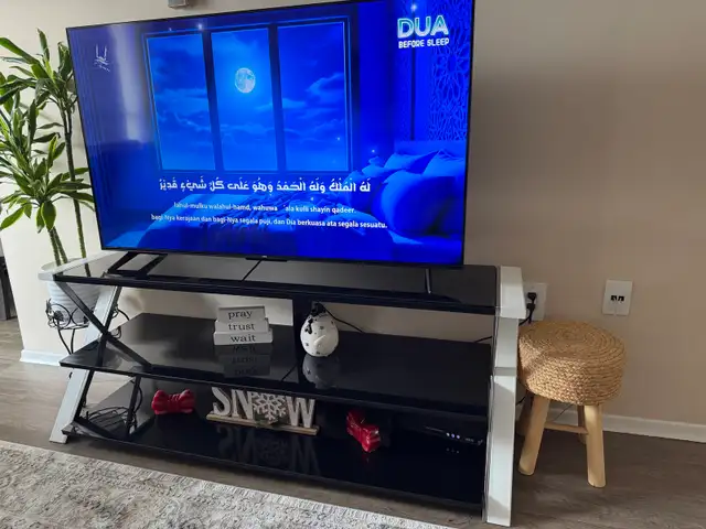 Selling a stylish black glass TV stand and display unit.