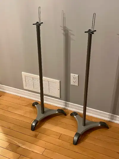 Pair of gray/silver speaker stands.