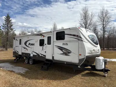 2013 Palomino Puma 30FBSS Sleeps 9 Front bunk house with 3 single beds Side Paw outdoor kitchen! Rea...