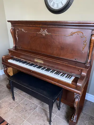 Vintage upright piano manufactured June 22nd 1891 at the Newcombe Piano Co. Includes bench In workin...