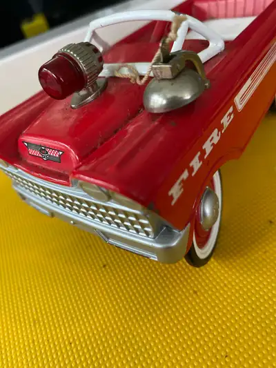 Collectable toy fire truck, heavy solid toy from back in the day it is missing the steering wheel bu...