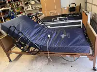 Hospital bed with new medical mattress and rails 