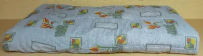 This decorative comforter has been stored (in original plastic cover) for years without being used.....