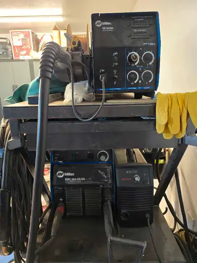 Miller XMT 304 cc/cv multi process welder and Miller 60 series 24v wire feeder for sale. Both are in...