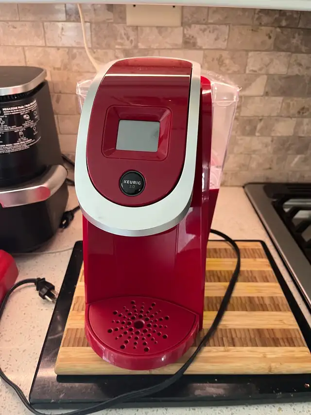 red Keurig coffee including pod drawer