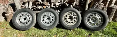 Four P235 60R15 Goodyear Eagle GTII Tires in Excellent Condition on Ford 15x7in Aluminum Rims. 4-Lug...