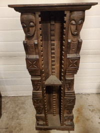 Tribal carved wooden cd tower