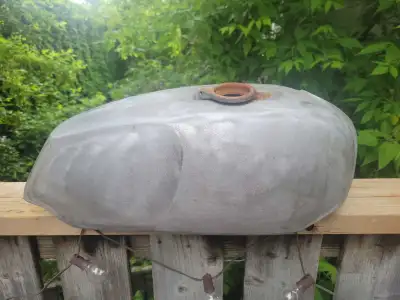 OEM Commando steel tank. Freshly sand blasted. Ready for paint. Any rust showing can be quickly wipe...