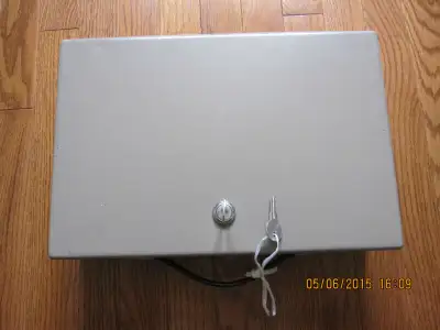 Locking strong box and comes with 2 keys. Dimensions: L 14", W 9.25", H 3"