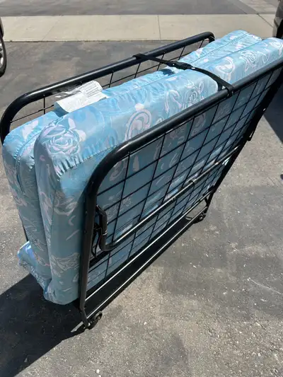 Twin size folding bed with mattress for sale. Rollaway. Clean and good condition. $70. Sent text at...