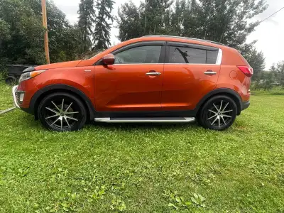 2013 Kia Sportage, loaded, leather, 2.4 engine AWD, comes with winter tires. Cruise control & Blueto...