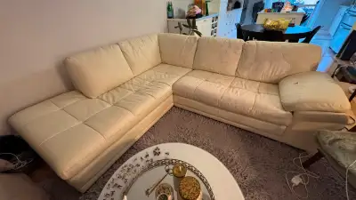 Off-white faux leather couch with pealing spots. The structure is good, the couch is comfortable but...