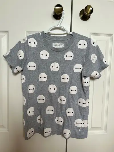 Embrace your love for Disney's enchanting characters with this charming Baymax pattern T-shirt from...